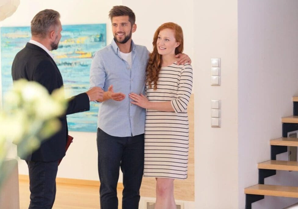 A man and woman standing next to each other.